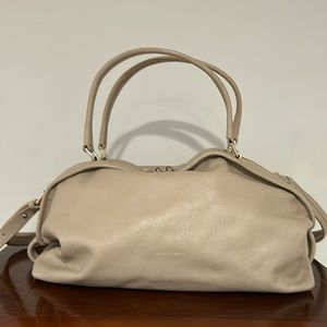 A See by Chloe hand bag.  Leather. Cream colored